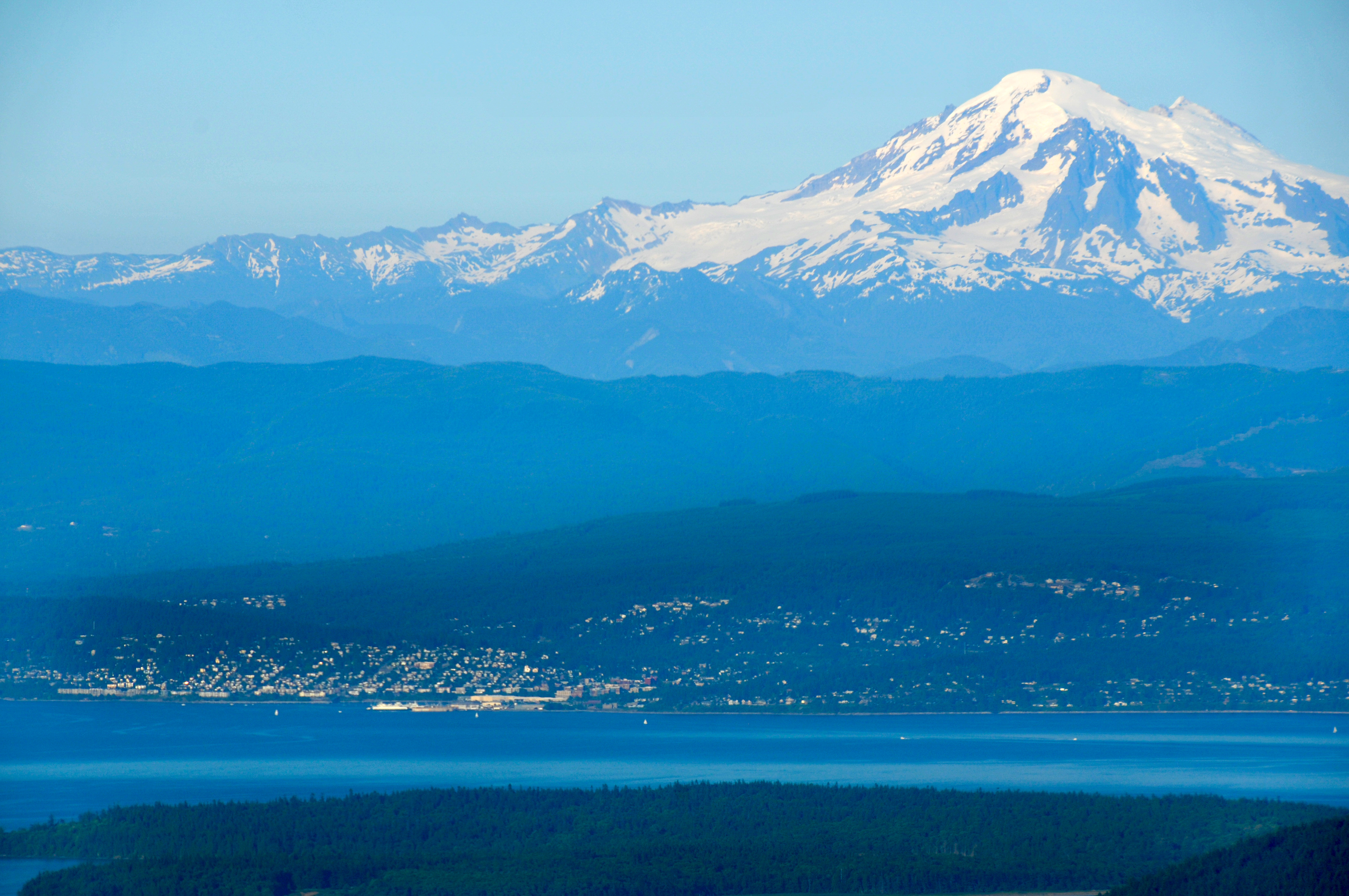 landscape of Bellingham WA city with white mountains in blue skies